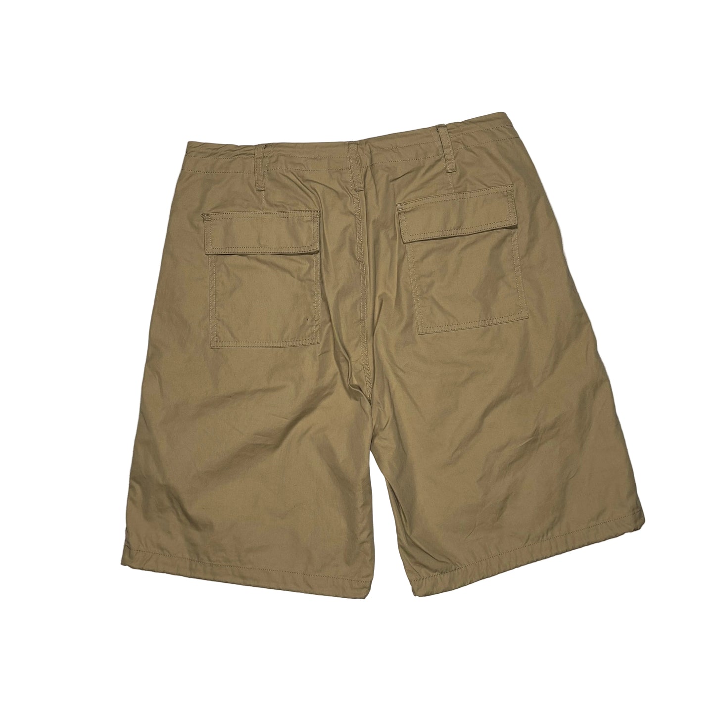 khaki shorts on a white surface