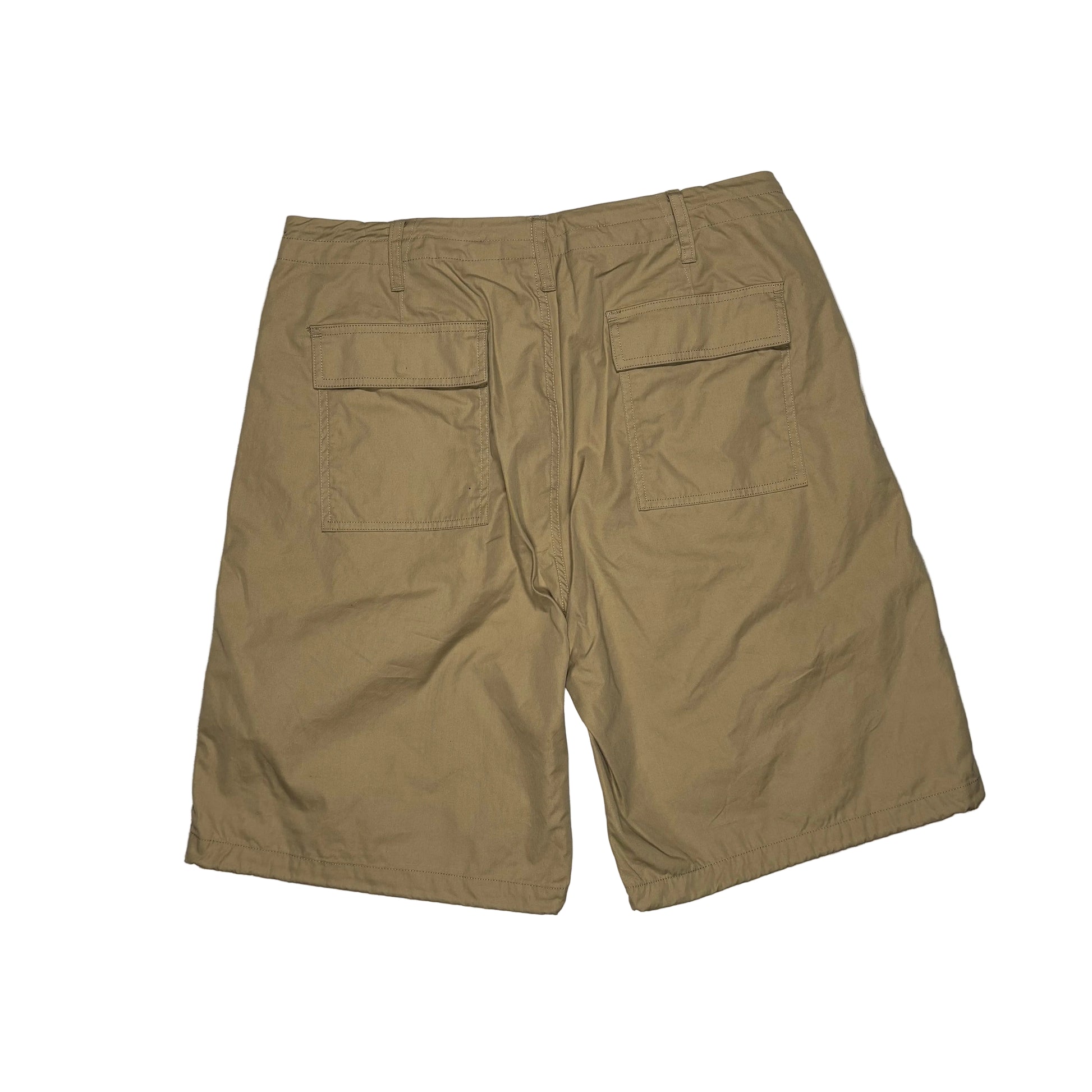 khaki shorts on a white surface