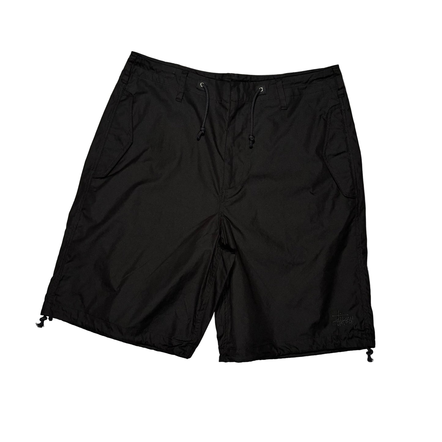 Black shorts on a white surface