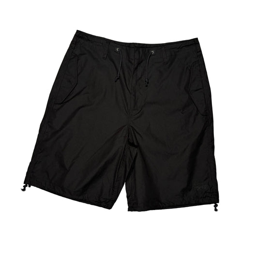 Black shorts on a white surface