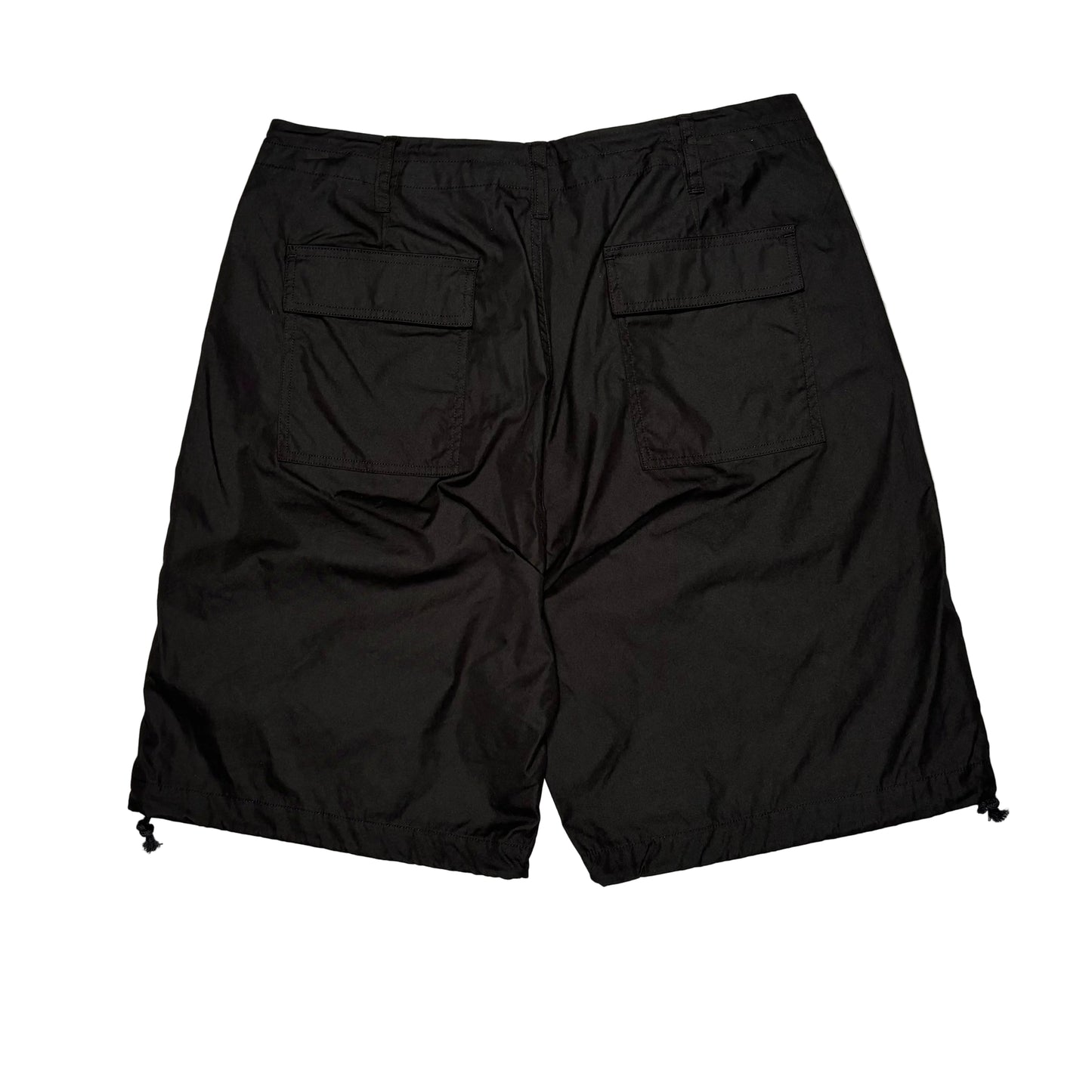 Black shorts on a white surface