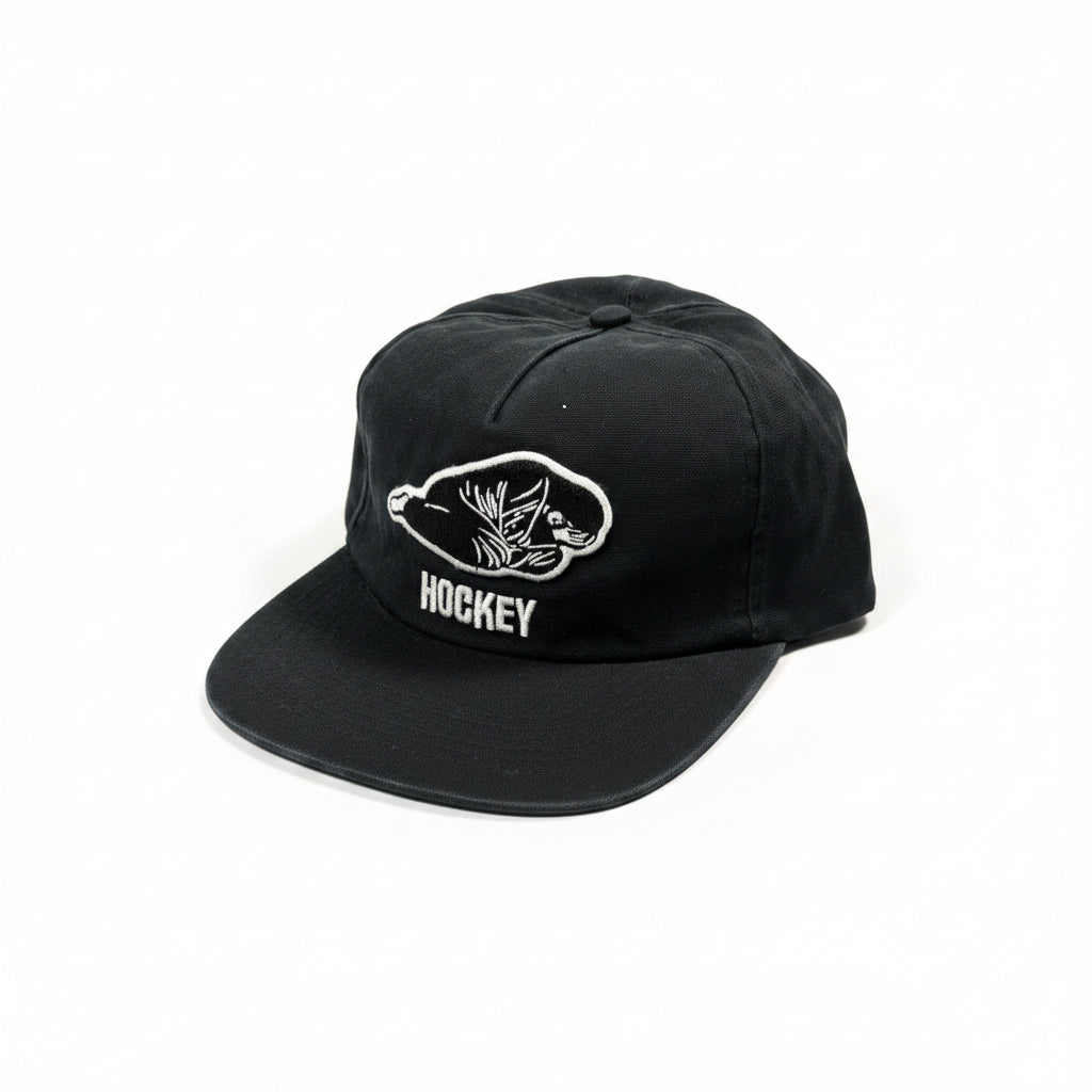 Black cap with white logo and text on a white surface