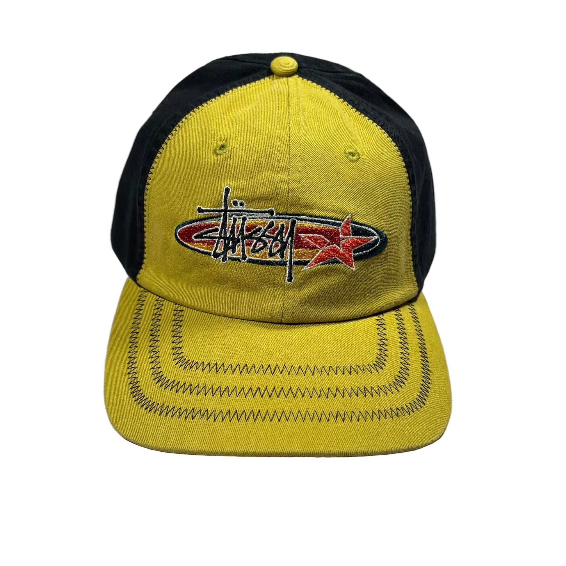 Lime and black cap with a stussy oval star logo on a white surface