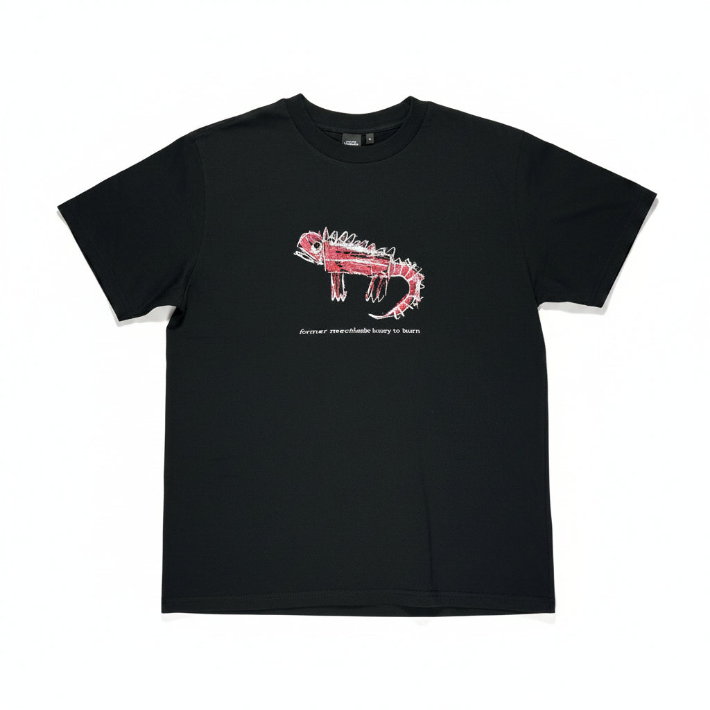 Black t-shirt with a red and white dinosaur like graphic on a white surface