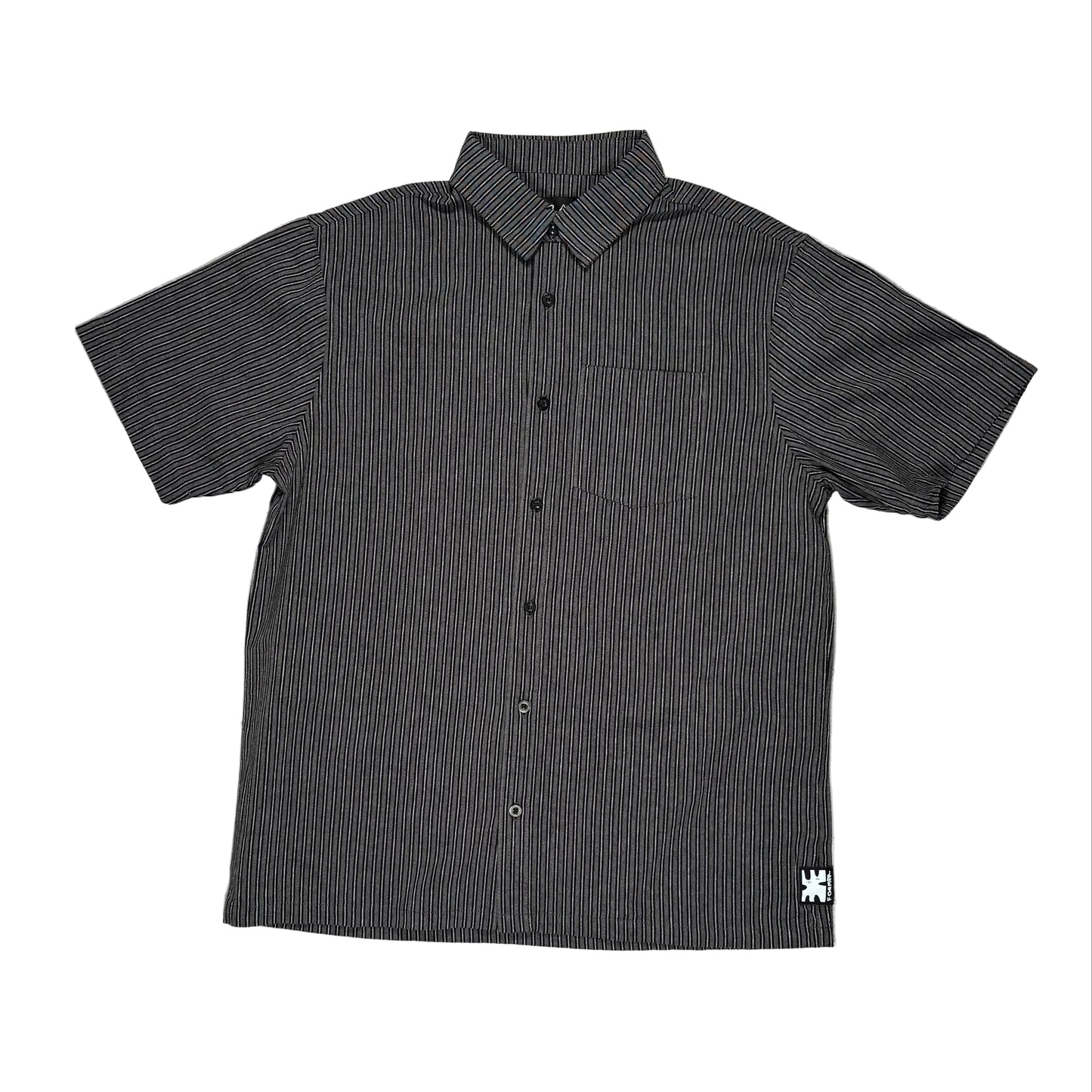 Black short-sleeve button-up shirt with a small logo on a white surface