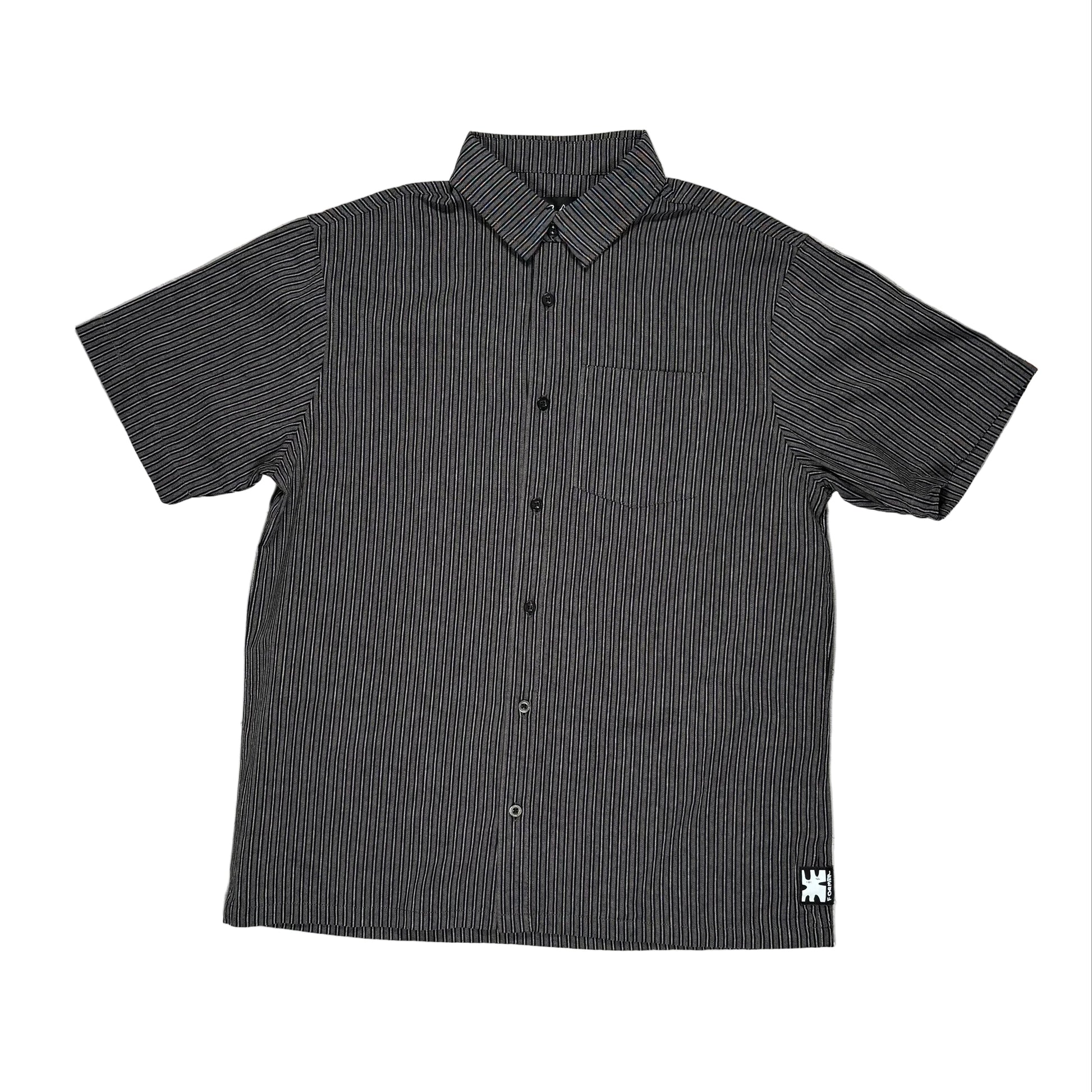 Black short-sleeve button-up shirt with a small logo on a white surface