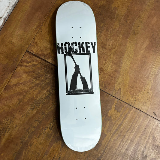 white and black logo on bottom of skateboard deck of two hands holding up an axe