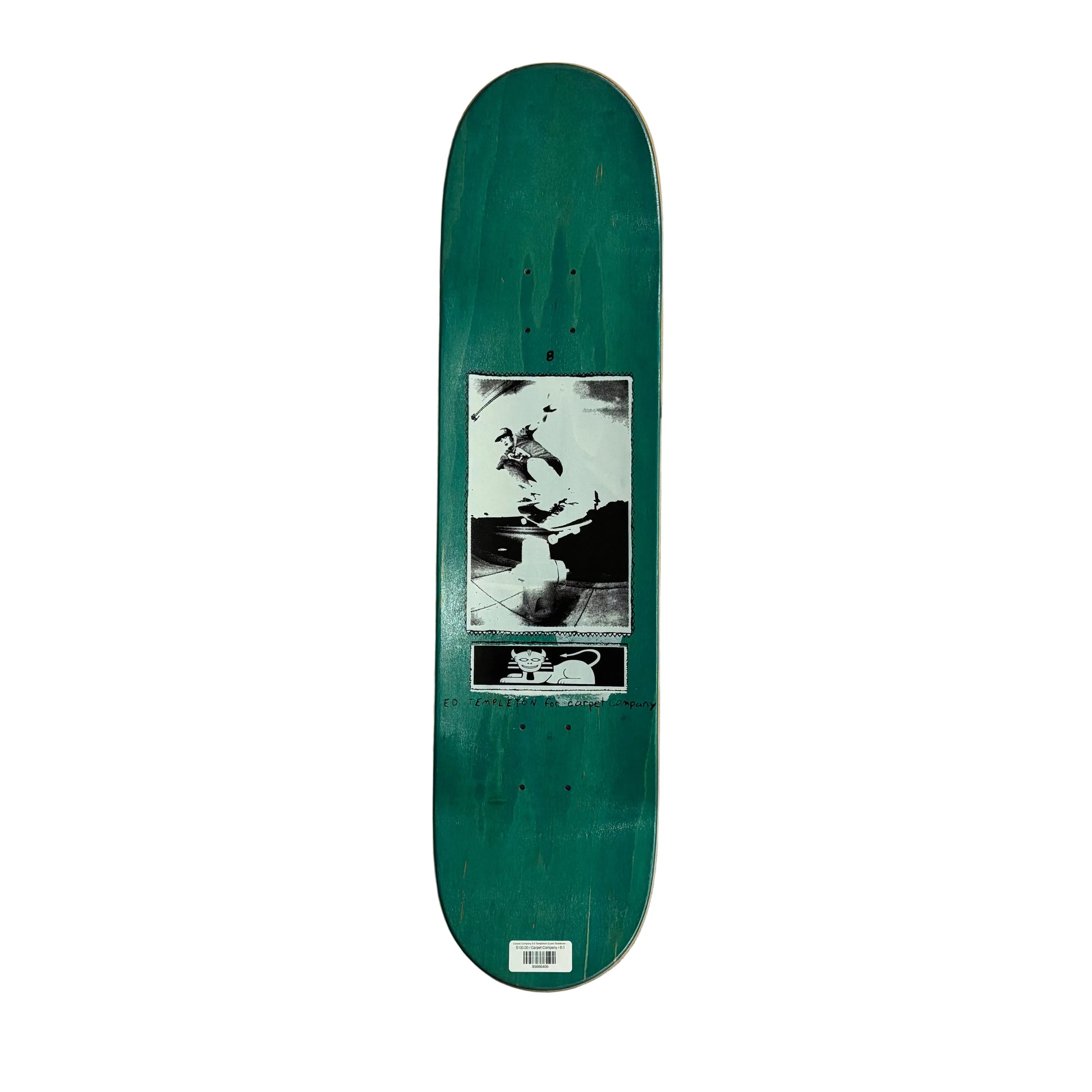 view of top of Green skateboard deck with a black and white graphic on a white surface