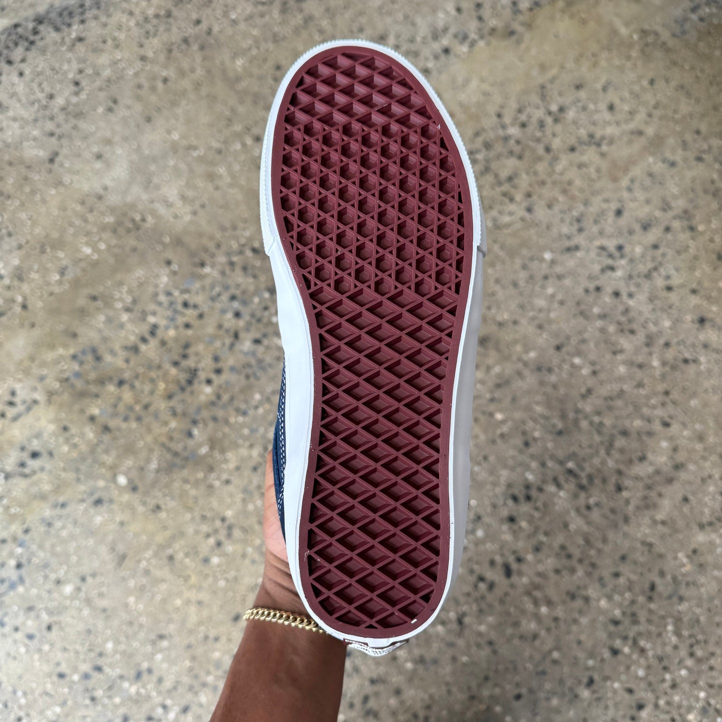 view of the shoe sole. burgundy