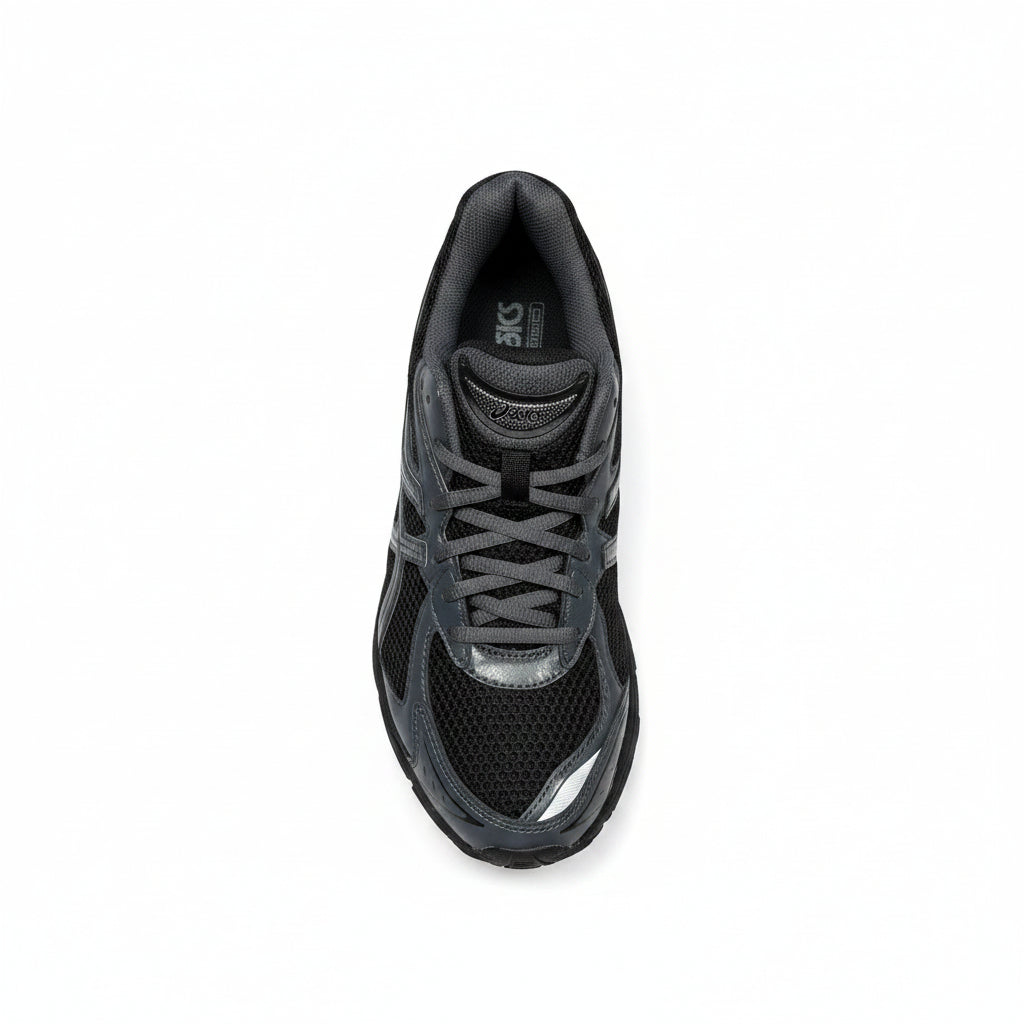 Black athletic shoe on a white surface
