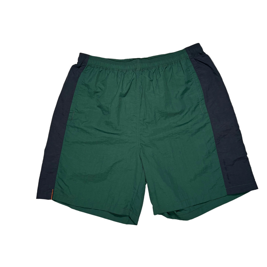 front view of green and blue nylon shorts on white background