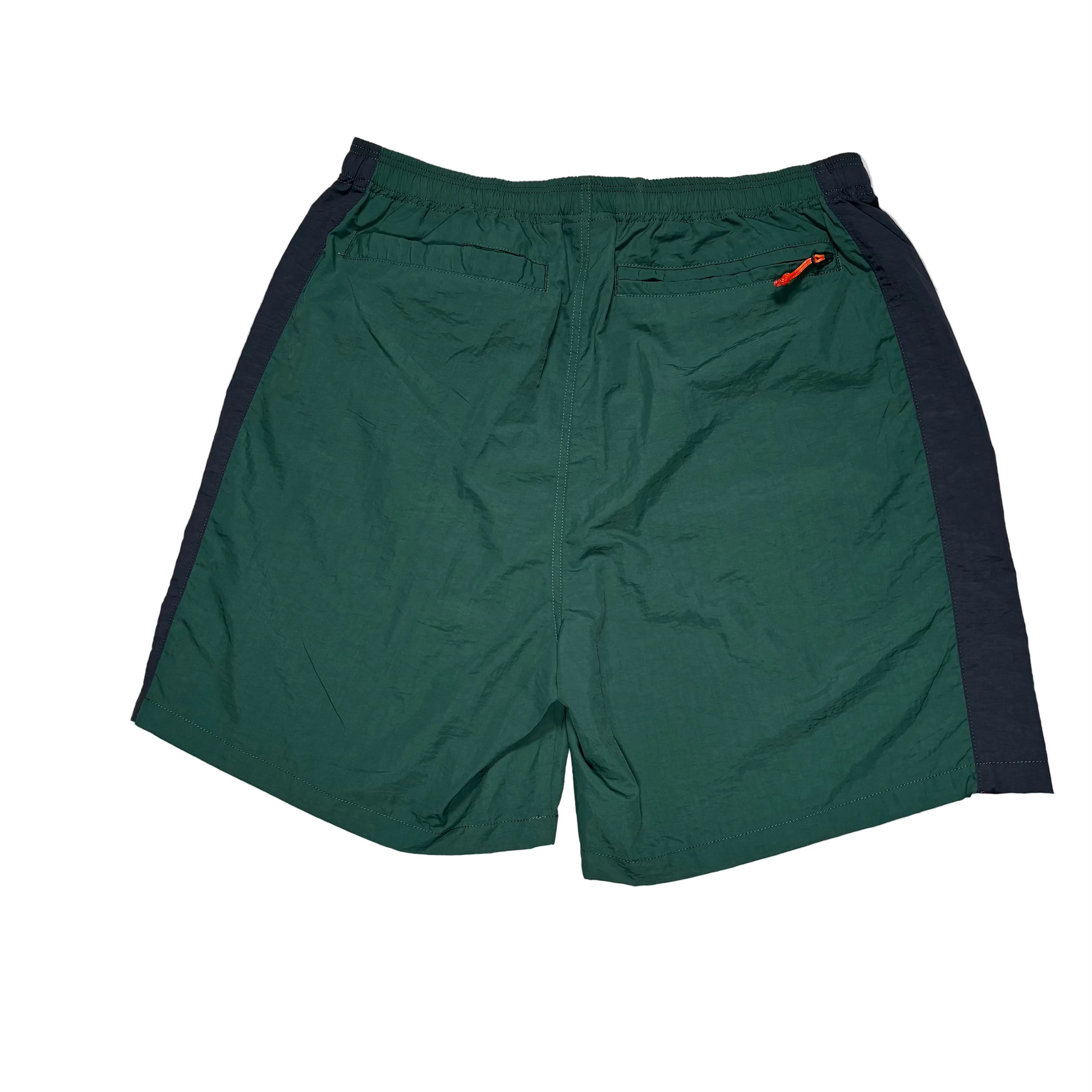 rear of green and blue nylon shorts on a white background