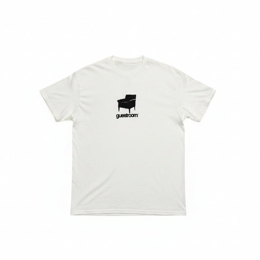 white t-shirt with chair and GUESTROOM printed on center chest of the t-shirt, on a white background