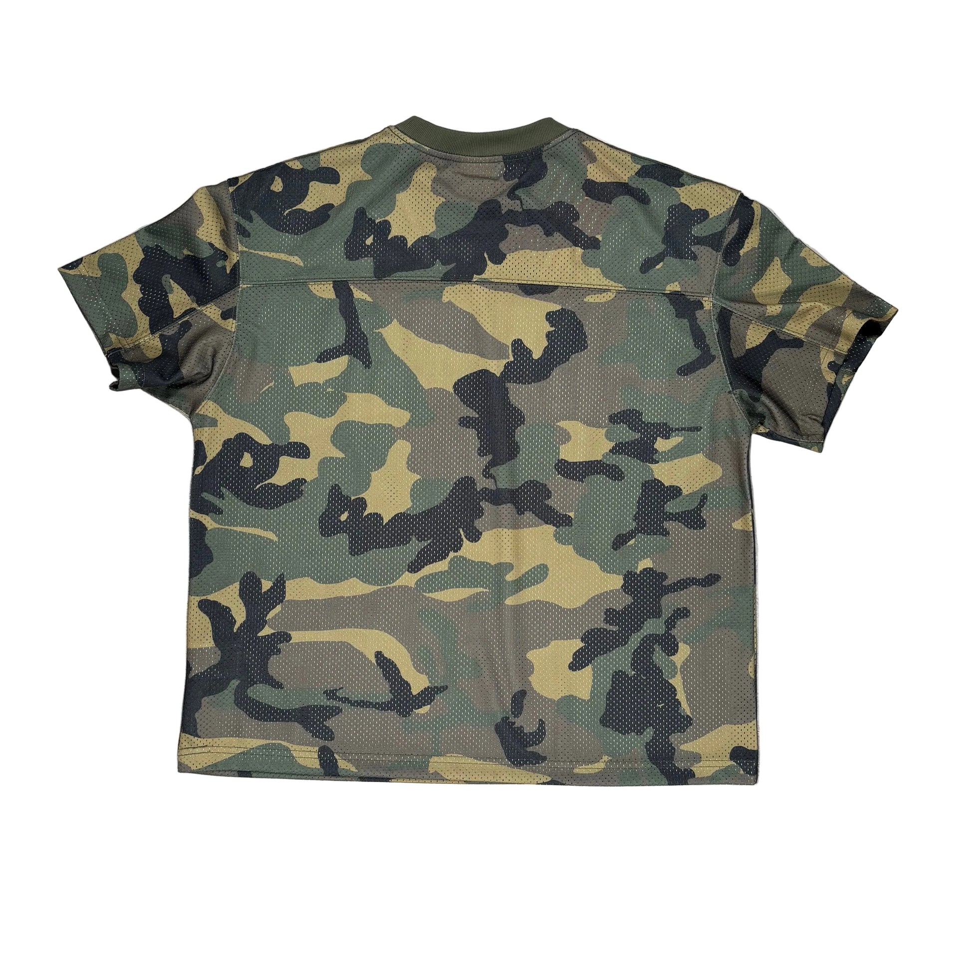 A short-sleeve athletic jersey with a green, black, and tan camouflage pattern, laid flat on a white surface.