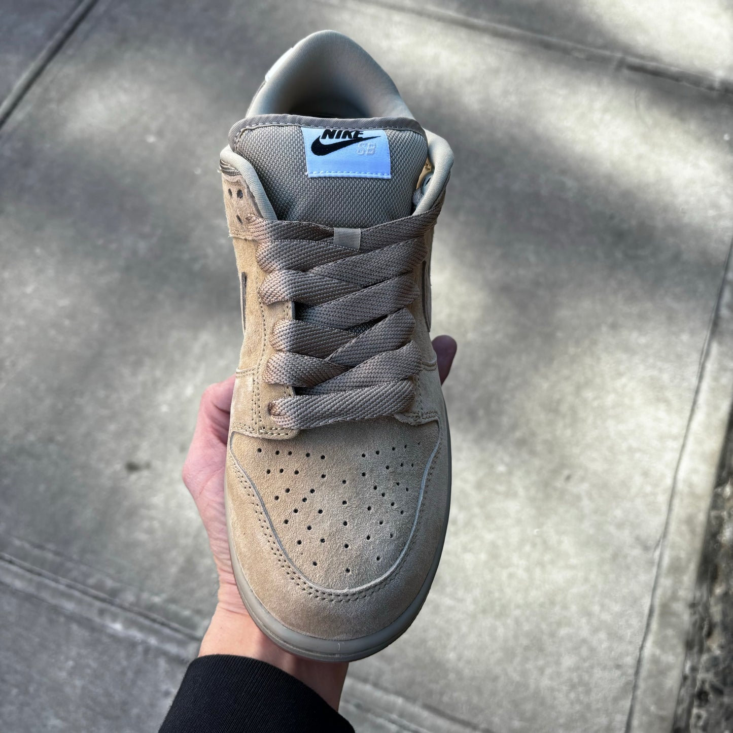 top down view of beige suede lowtop sneaker