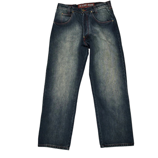 A pair of dark blue denim jeans laid flat on a white background, The brand name 'C-STAR JEANS' is visible on the inner waistband label.