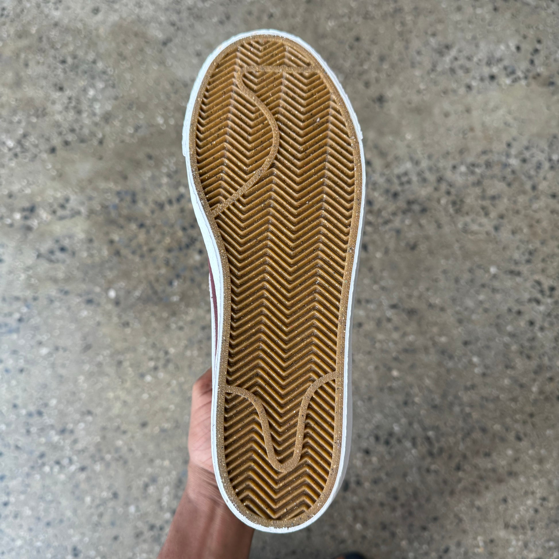 view of the shoes sole. gum colored