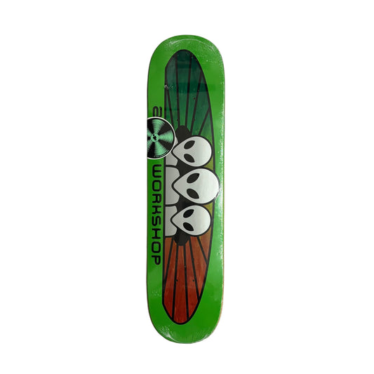 A green skateboard deck featuring a graphic of three white aliens on a red and green wing-like design, with the word 'ALIEN WORKSHOP' printed horizontally, photographed from above on a white background