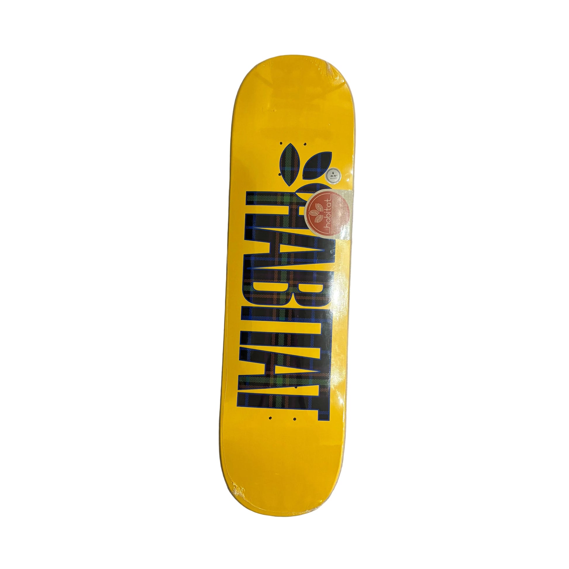 A yellow skateboard deck with a large black HABITAT logo printed vertically, shown flat on a white surface