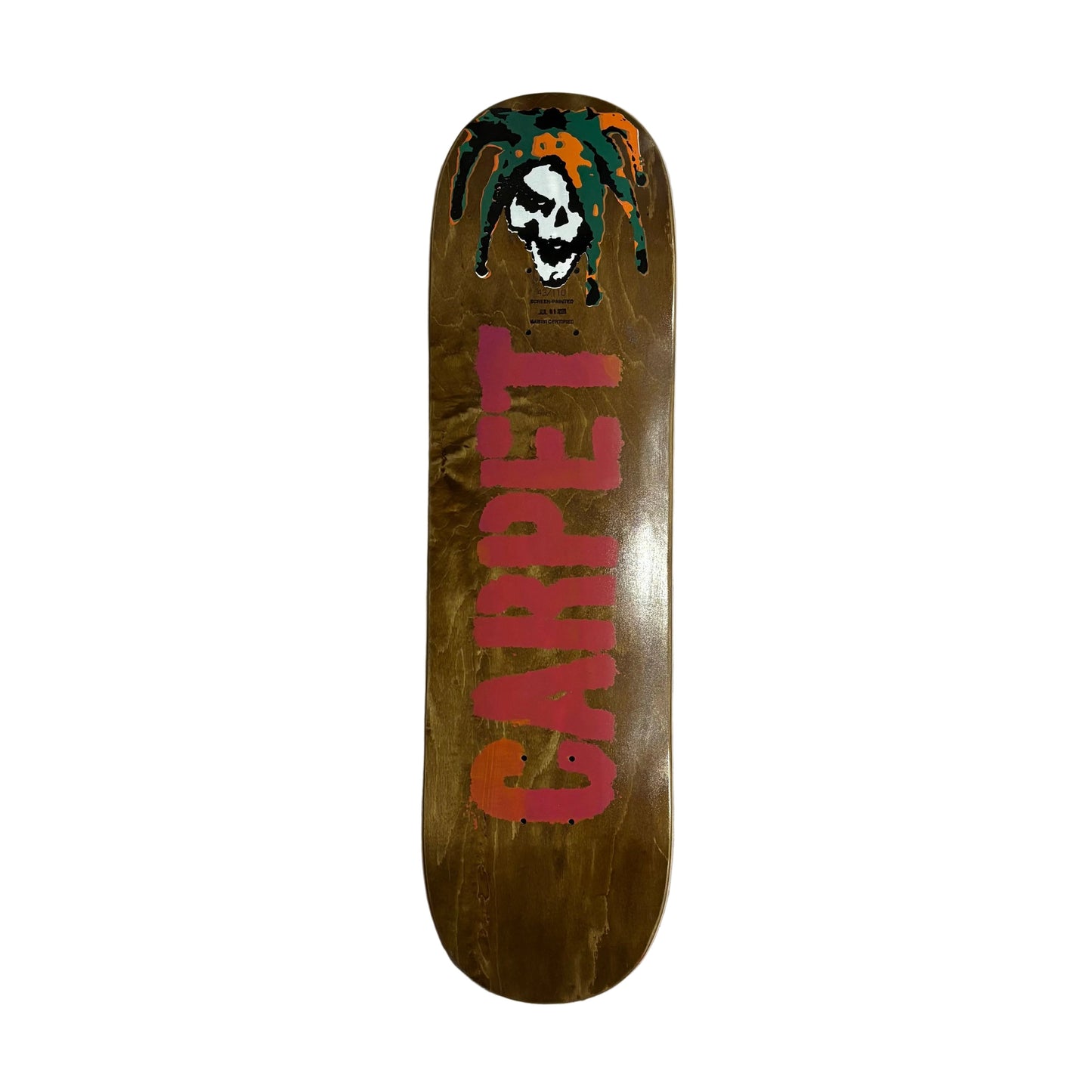 A skateboard deck with a natural wood-grain brown base, featuring a red 'CARPET' graphic and a skull in a Dreadlocks design at the nose, displayed on a white surface.