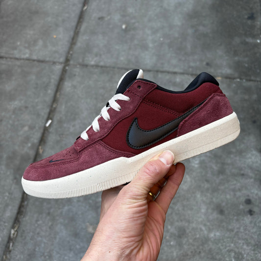 side view of burgundy suede and nylon skateshoe
