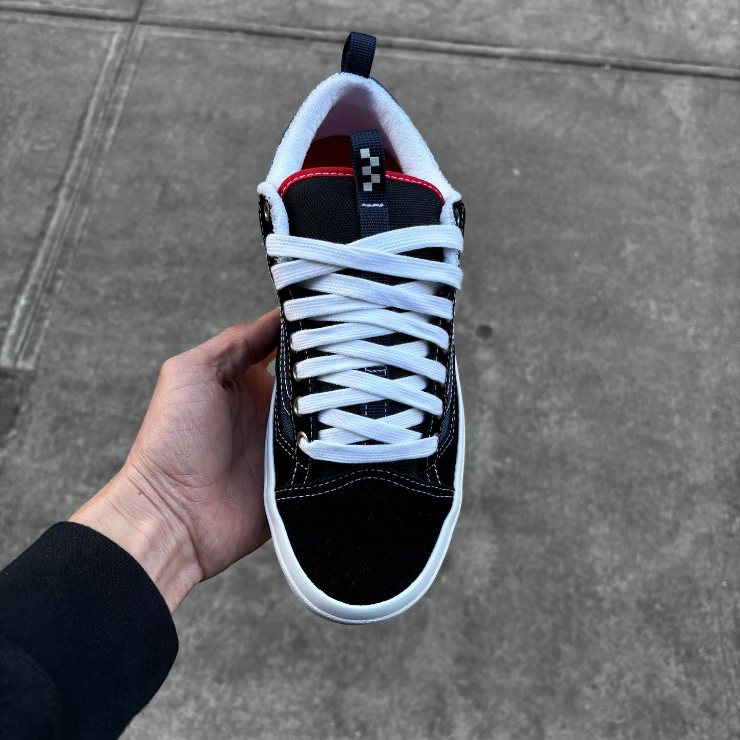 Top down view of black and navy skateboard sneaker