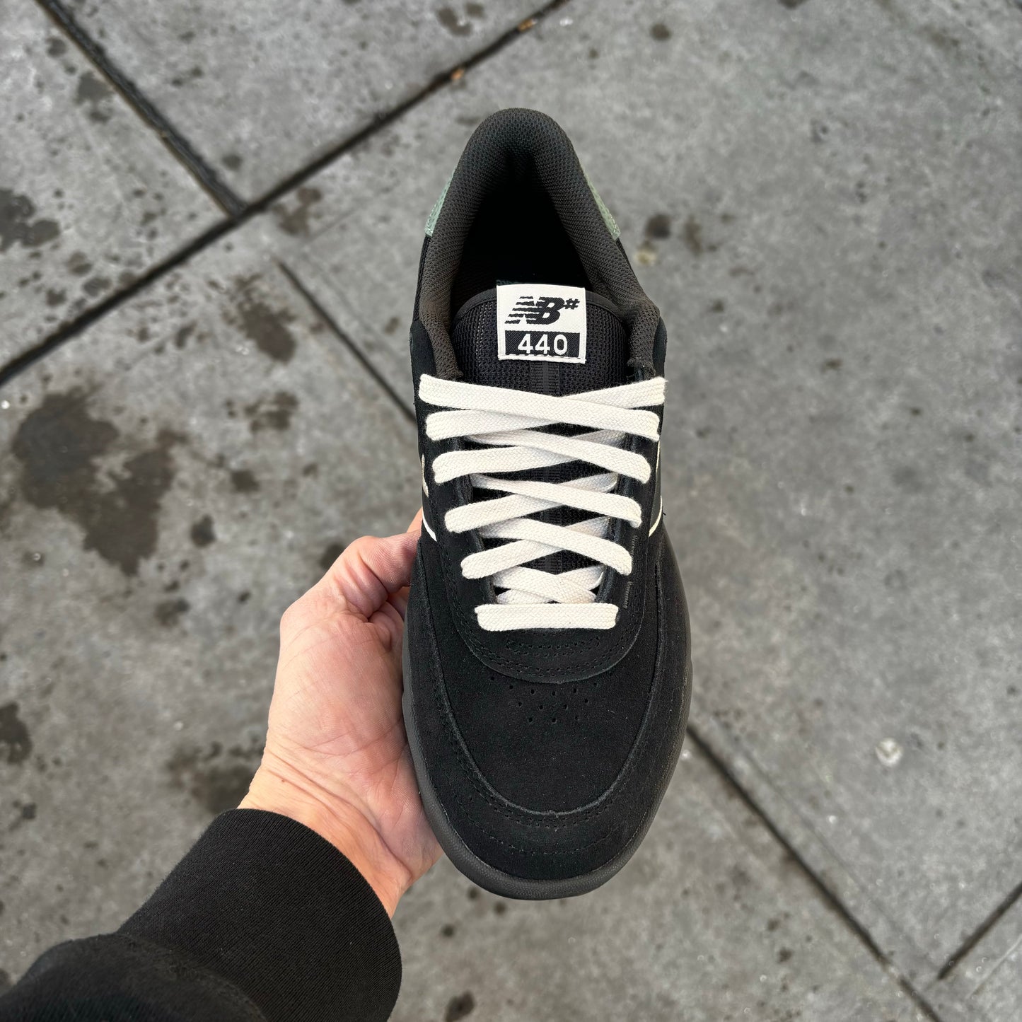 top down view of black/white suede skateboard sneaker