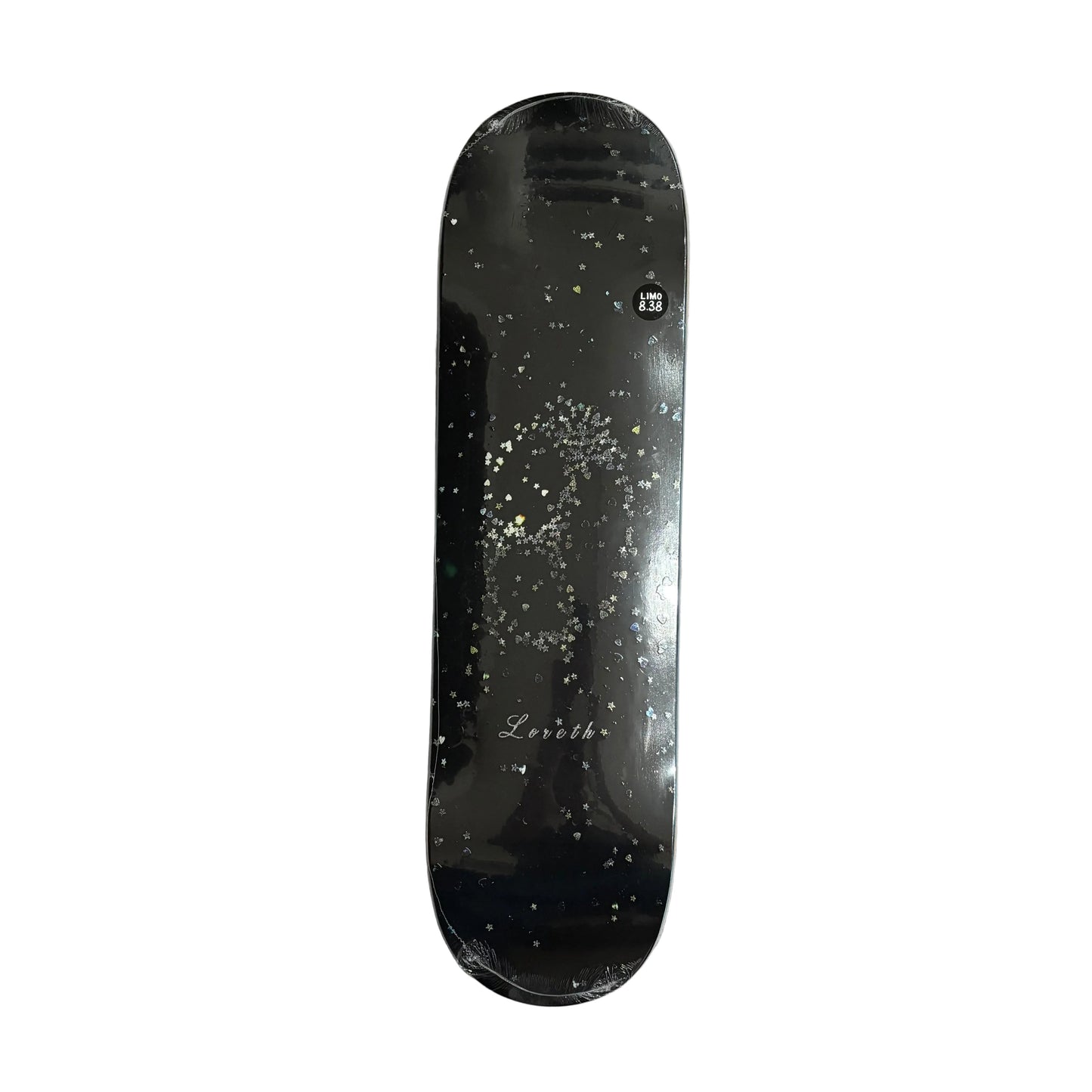 A black skateboard deck with a glittery gold and silver skull graphic and 'Loreth' on the board, on a white background