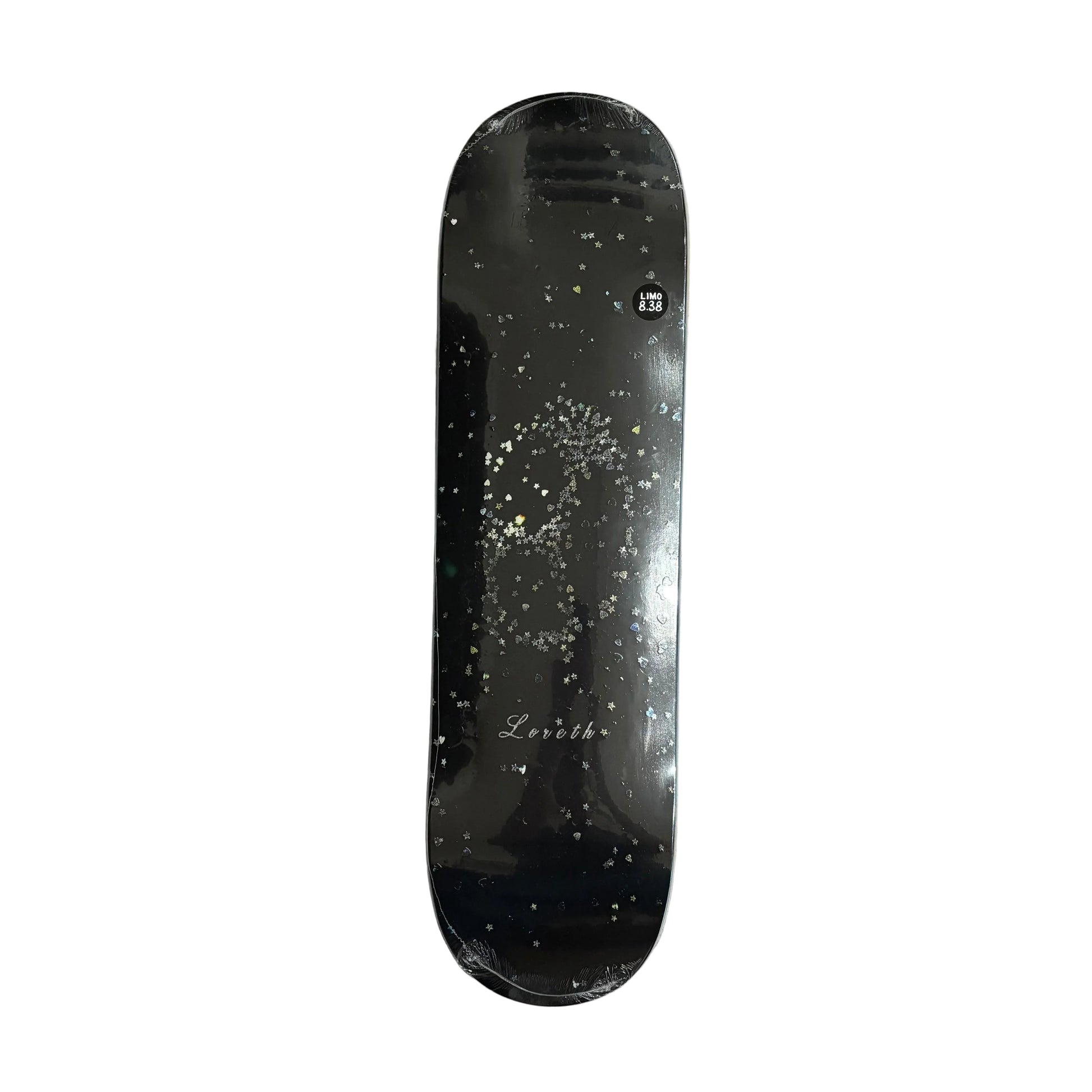 A black skateboard deck with a glittery gold and silver skull graphic and 'Loreth' on the board, on a white background