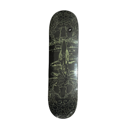 A skateboard deck with a black background and intricate light green and white line art, displayed vertically on a white background