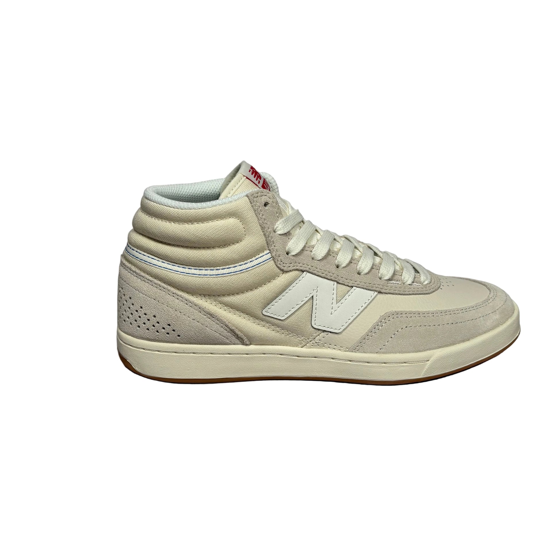 A single New Balance mid-top sneaker in light beige suede and mesh, shown from the side against a white background.