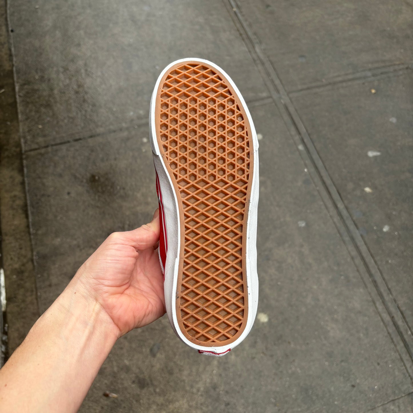 gum rubber outsole view of red suede skateboard sneaker