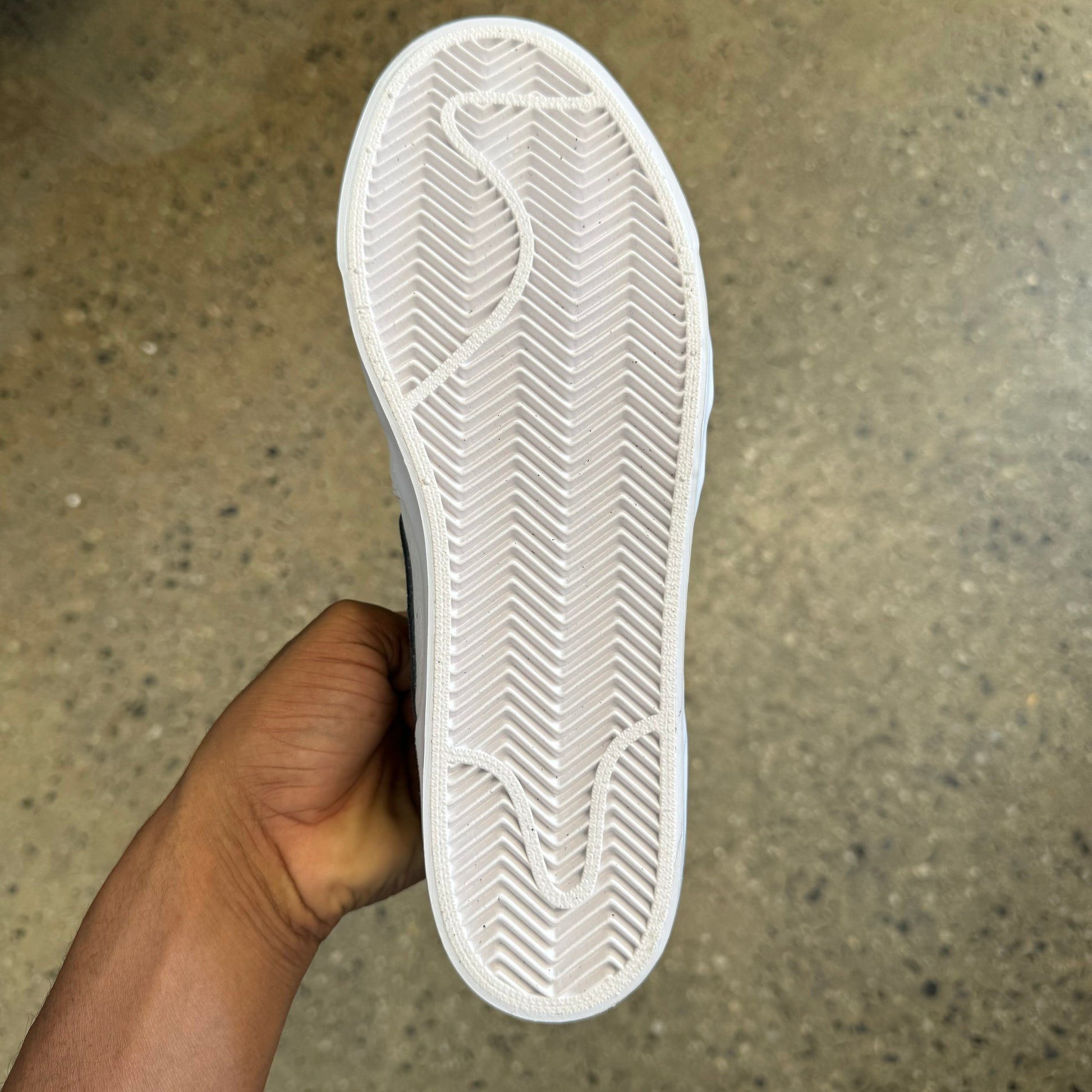 bottom view of the shoe. white rubber sole