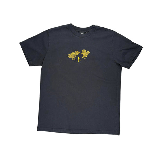 A dark charcoal gray short-sleeve t-shirt with a yellow bird graphic on the chest, laid flat on a white surface 