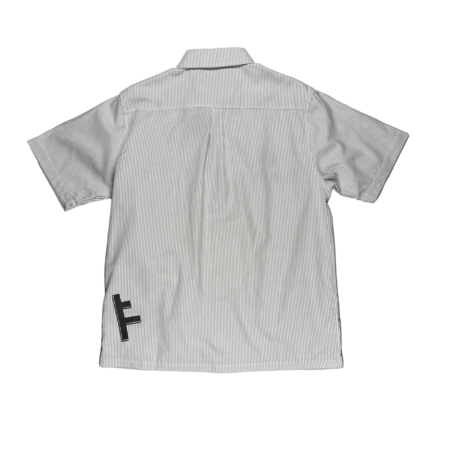 A light gray and white vertically striped short-sleeve button-up shirt shown from the back, laid flat on a white surface with A black screen print with a stylized letter 'F' is visible near the lower left back.