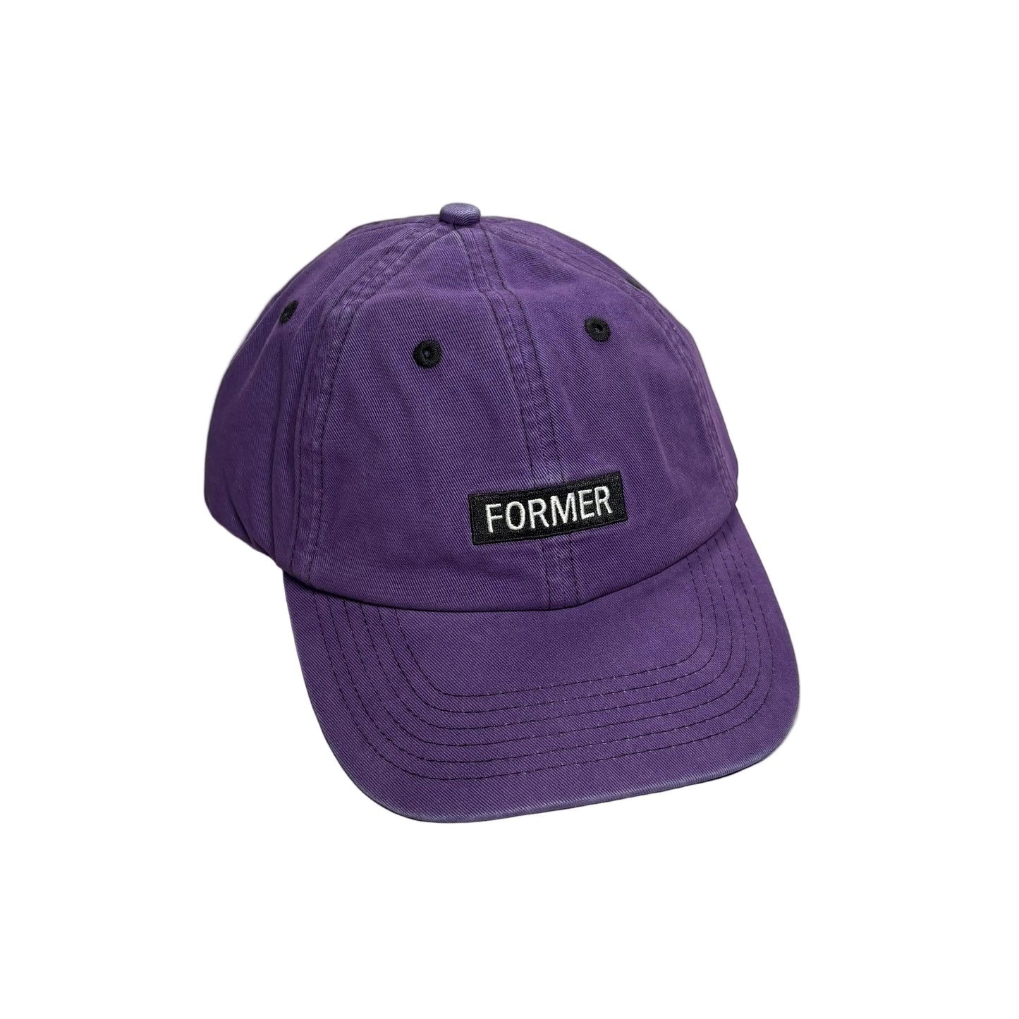 A purple cotton baseball cap with a black rectangular patch on the front that reads 'FORMER' in white text, photographed on a white background.