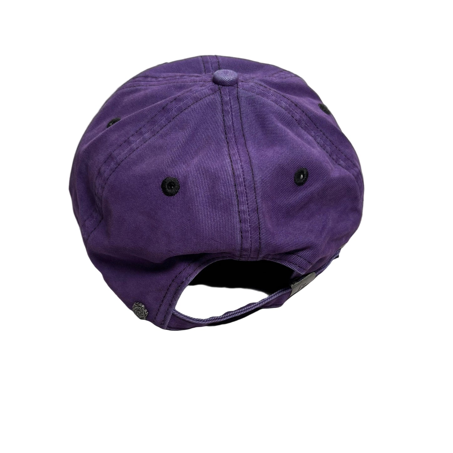 A purple cotton cap with a curved brim and adjustable snap closure, photographed on a white surface.