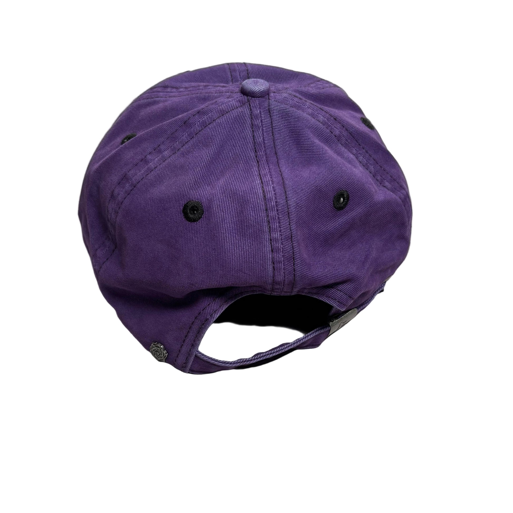 A purple cotton cap with a curved brim and adjustable snap closure, photographed on a white surface.