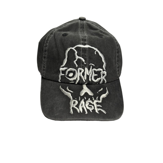 A washed black baseball cap featuring a white embroidered skull design with the words 'FORMER RAGE' on the front, displayed on a white surface.
