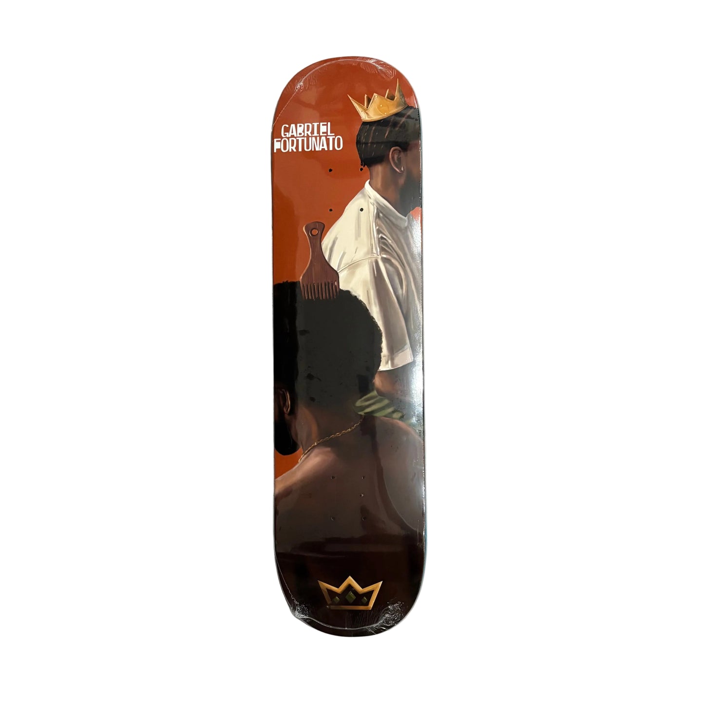A skateboard deck featuring a graphic design of two men in profile against an orange and black background, with a gold crown logo at the bottom and the text 'GABRIEL FORTUNATO' near the top. The deck is on a white surface.