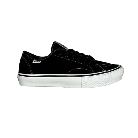 A black suede low-top sneaker with a white rubber sole, photographed from the side against a white background.