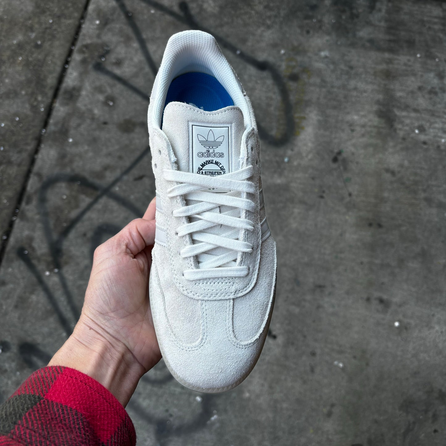 top down view of white suede skateboard sneaker