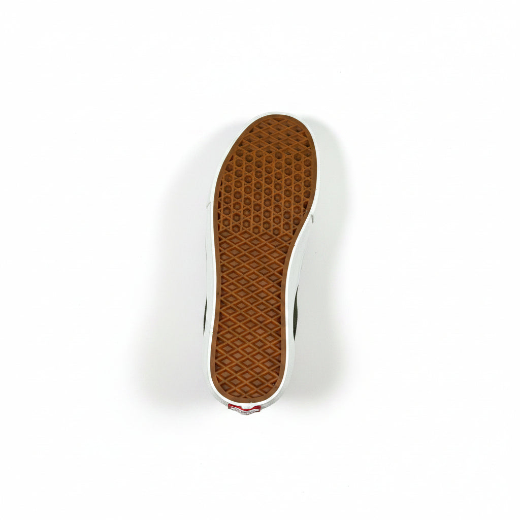 A single Vans shoe shown from a top-down view, highlighting the brown waffle-patterned outsole and white side profile against a white background.