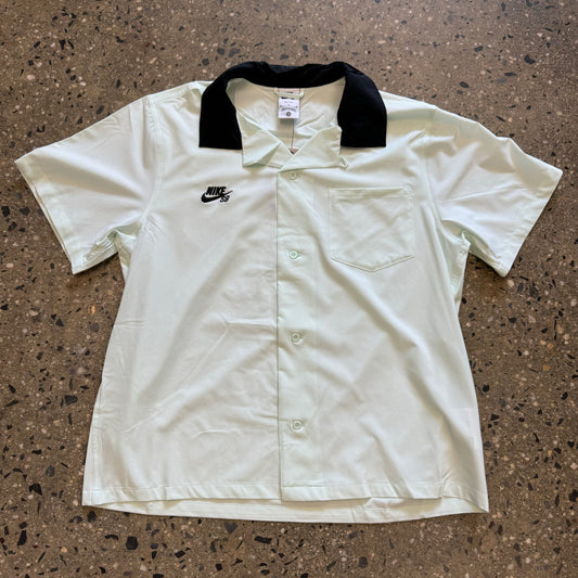 very lightly mint colored button up bowling style shirt with black color and nike sb logo on the right 