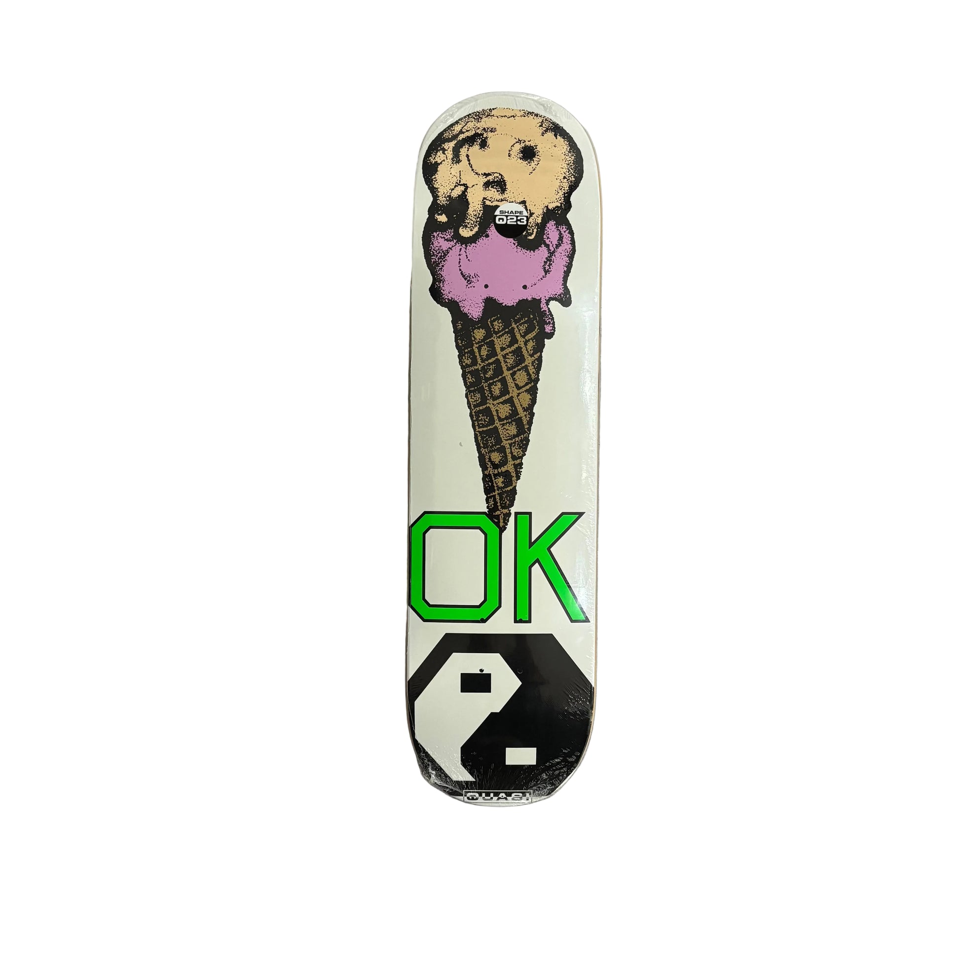 A skateboard deck featuring a graphic of an ice cream cone on a white background, with the green letters 'OK' and a black-and-white geometric symbol on the underside.