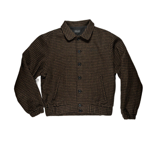 A dark brown and black checkered button-up jacket with a pointed collar, and black buttons.  Displayed on a white background.