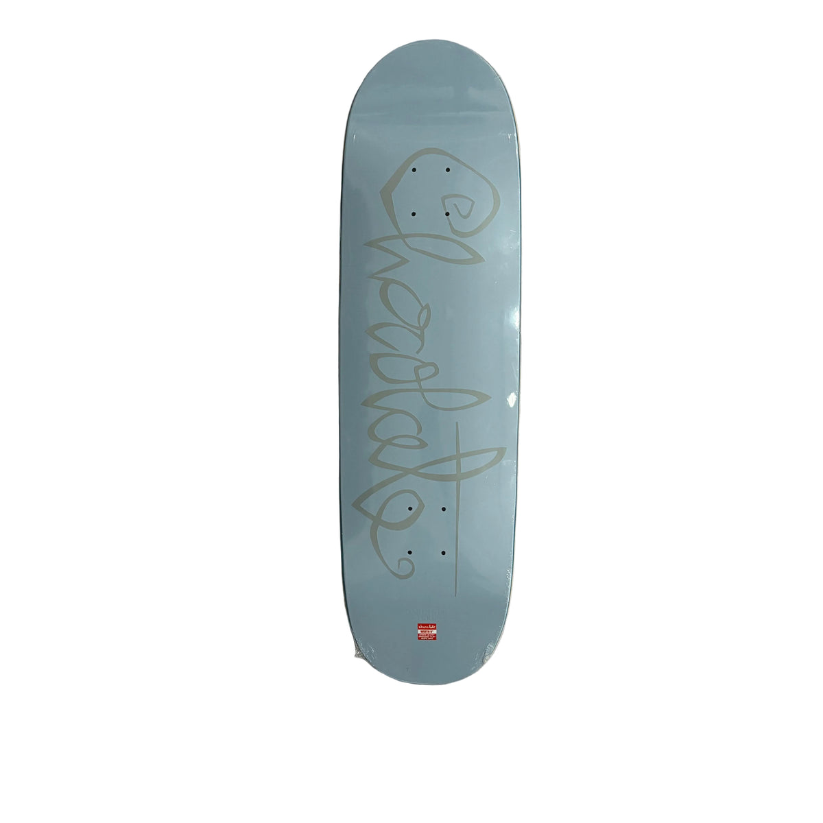 A light blue skateboard deck with a grey script Chocolate graphic and a small red logo near the bottom, photographed flat against a white background.