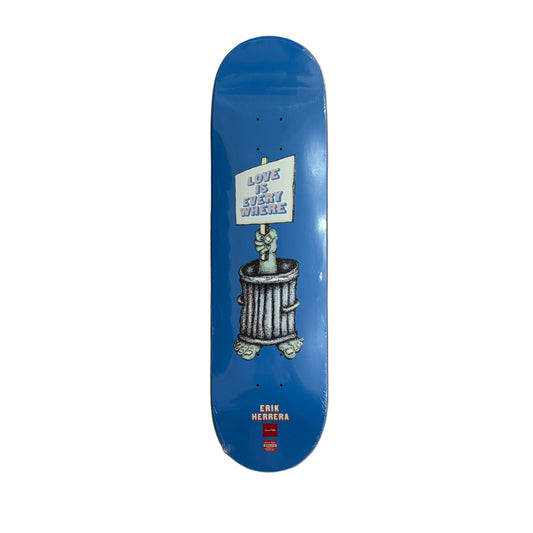 A blue skateboard deck featuring a graphic of a hand emerging from a trash can with a sign that reads 'LOVE IS EVERY WHERE', displayed flat against a white background.