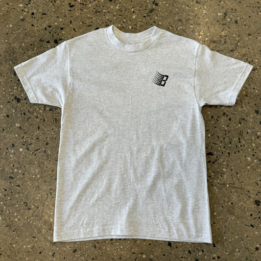 ash grey t shirt with small bronze logo on the left of the chest
