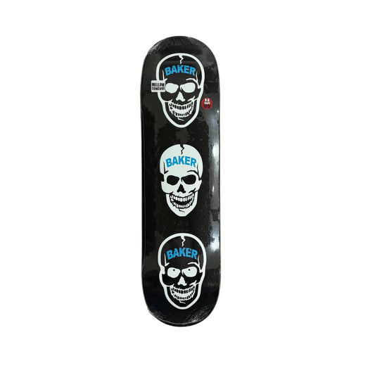 A skateboard deck with a black background and three vertical white skull graphics, each labeled 'BAKER' in blue, photographed from above on a white surface.